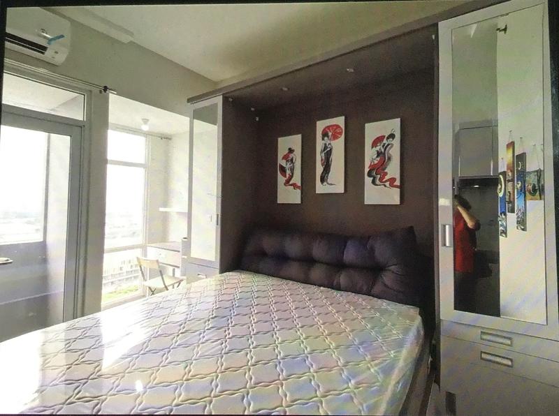 wallbed when opened, table, chair